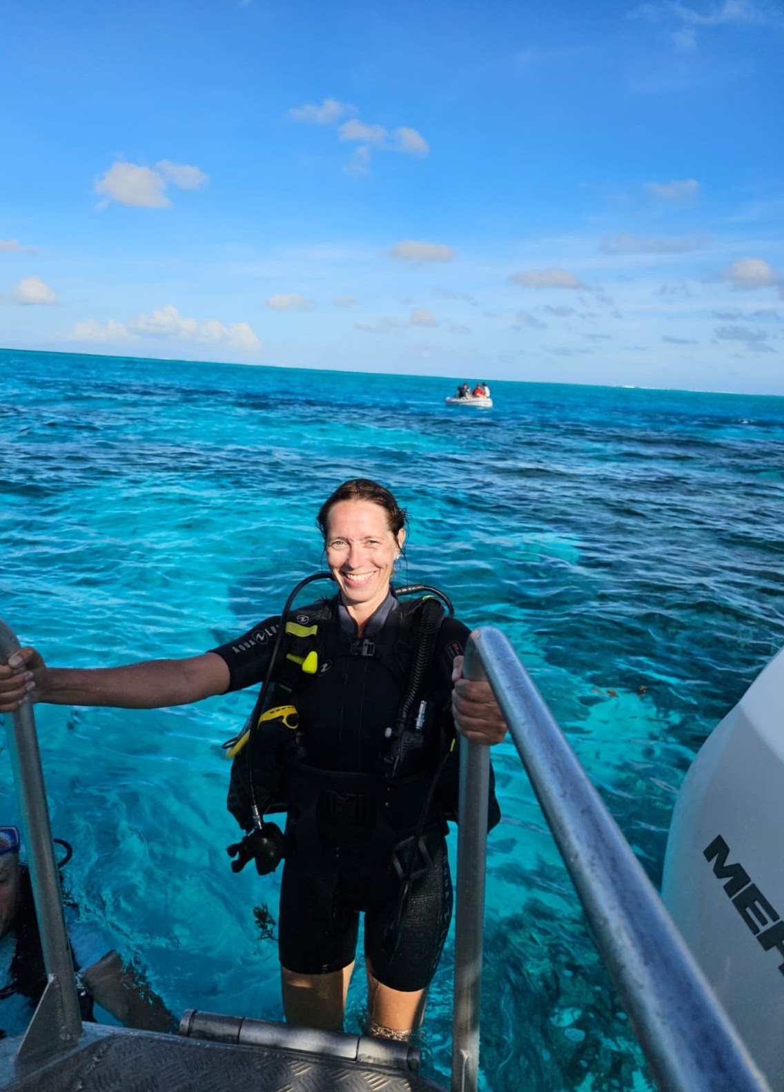 Heni, luxury travel advisor and PADI-certified diver, preparing for a dive in French Polynesia